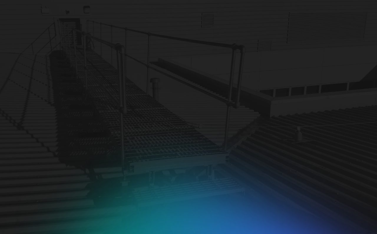Rooftop walkway with safety handrails on a commercial building